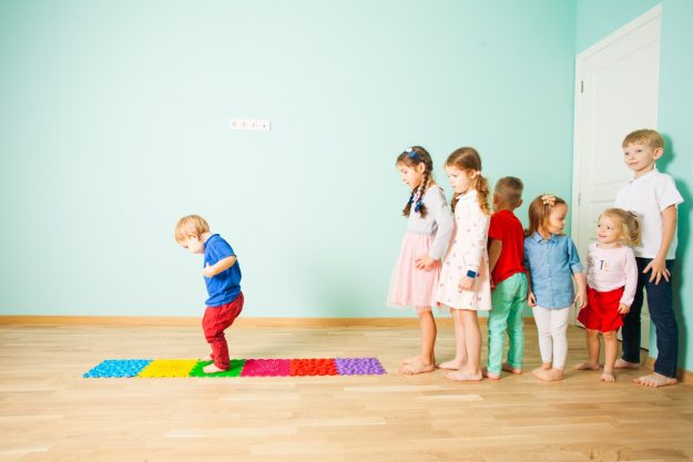 people-standing-wooden-floor-min